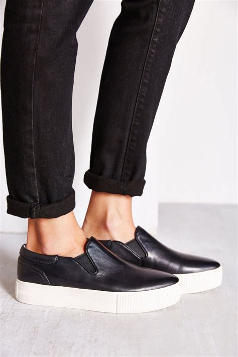 black platform slip on sneakers.